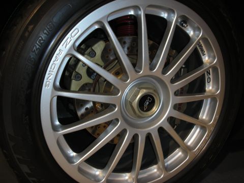 1998 Ford Crown Victoria - Close-up of an OZ Racing wheel, showing tire sidewall details and brake system components.