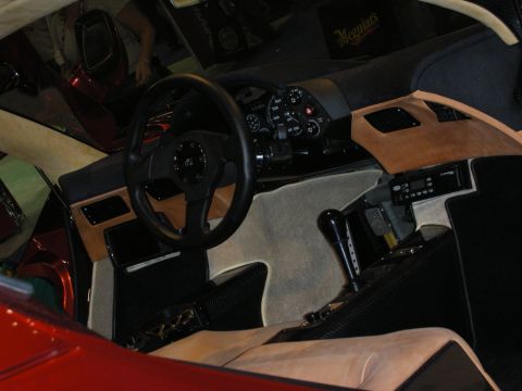 1998 Ford Crown Victoria - Interior view of a car's dashboard, steering wheel, and center console.