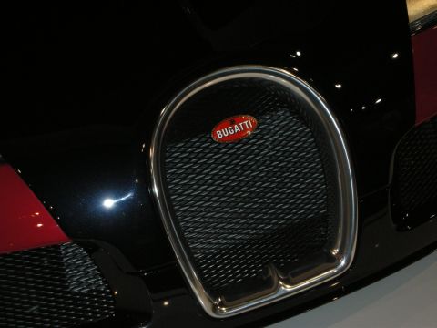 1998 Ford Crown Victoria - Close-up of the distinctive Bugatti horseshoe grille on a black car.