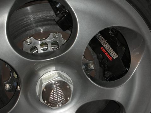 1998 Ford Crown Victoria - Koenigsegg brake caliper and wheel hub detail, showing ceramic brake system.