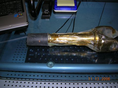1985 Ford Bronco - An automotive part, likely a stub axle, is shown wrapped in protective plastic packaging.