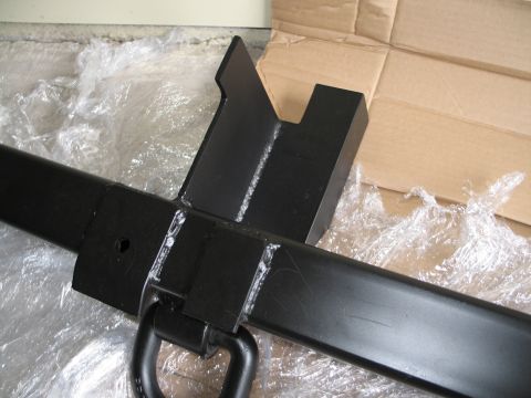 1995 Ford Bronco - Close-up of a black metal tow hitch receiver, likely for a truck or SUV, with a D-ring.
