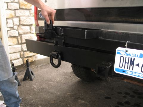 1995 Ford Bronco - Aftermarket rear bumper assembly for a Ford Bronco, a D-ring and tow hitch.