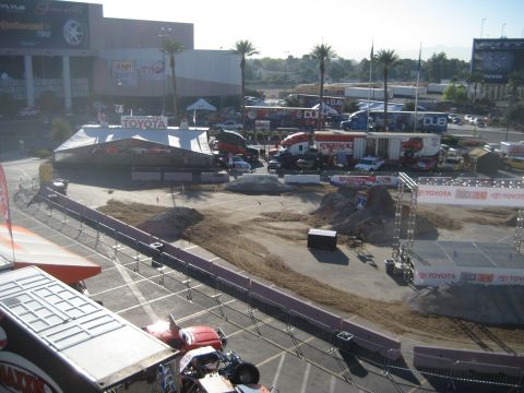 1998 Ford Crown Victoria - A large outdoor event area is set up with tents, multiple trucks, and a stage, prominent Toyota branding.