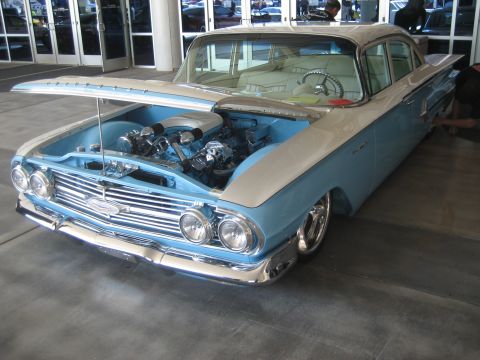 1998 Ford Crown Victoria - This customized classic sedan features a two-tone paint scheme and a detailed engine bay.