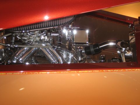 1998 Ford Crown Victoria - Close-up of a highly polished engine bay chrome components and dual intake runners.
