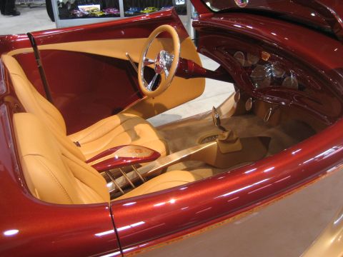 1998 Ford Crown Victoria - Interior view of a custom hot rod with tan leather seats and a red metallic exterior.