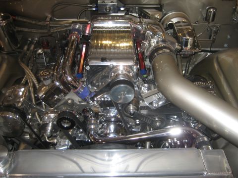 1998 Ford Crown Victoria - Custom engine bay with a prominent supercharger and polished components.