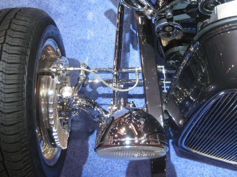 1998 Ford Crown Victoria - Detail shot of custom chrome headlight and suspension assembly.