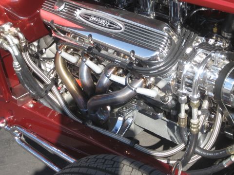 1998 Ford Crown Victoria - Close-up of a polished engine a Roush valve cover and custom exhaust headers.
