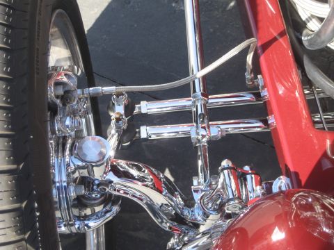 1998 Ford Crown Victoria - Detailed view of the intricate chrome suspension components on a custom vehicle.