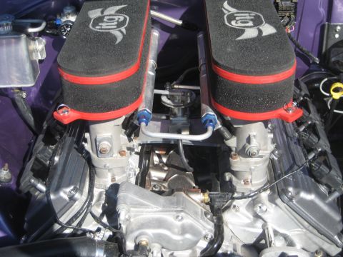 1998 Ford Crown Victoria - Close-up view of an engine bay, highlighting dual ITG air filters and custom intake components.
