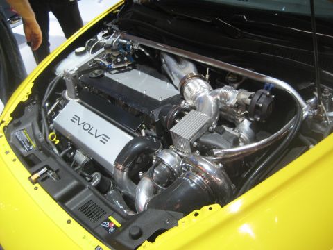 1998 Ford Crown Victoria - Close-up of a modified engine bay, custom turbocharger and intercooler components.