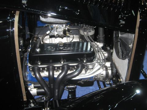 1998 Ford Crown Victoria - Close-up of a Ford V8 engine, showing custom headers and valve covers.