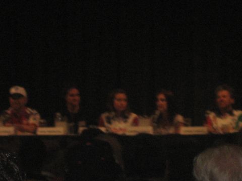1998 Ford Crown Victoria - A group of five individuals are seated behind a table, likely for a panel discussion or presentation.