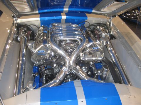 1998 Ford Crown Victoria - A highly customized engine bay features a chrome V8 engine with prominent Ford branding.