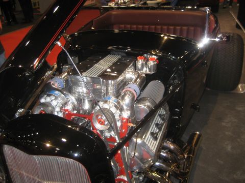 1998 Ford Crown Victoria - Close-up of a custom hot rod's engine bay, twin turbochargers and a polished V8 engine.