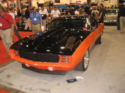 1998 Ford Crown Victoria - Custom 1969 Camaro on display at a car show.
