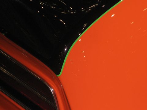 1998 Ford Crown Victoria - Abstract view of a car's exterior, focusing on color and line details.
