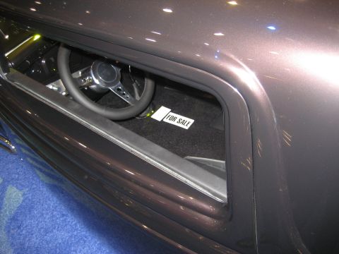 1998 Ford Crown Victoria - A 'For Sale' sign is visible on the floor mat inside a car's interior.