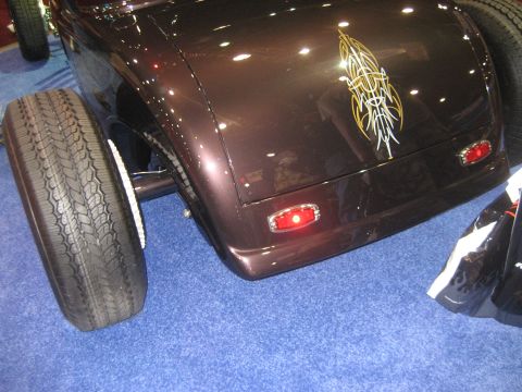 1998 Ford Crown Victoria - Custom hot rod rear end with pinstripe graphics and red taillights on display.