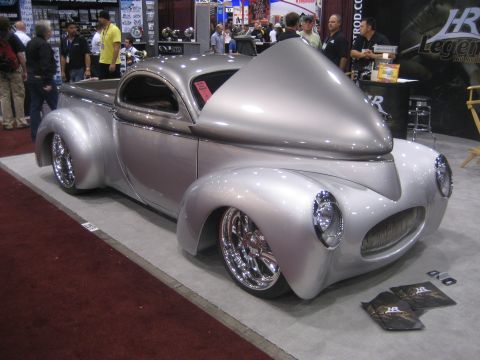 1998 Ford Crown Victoria - Custom hot rod pickup truck with a unique hood design on display at a show.