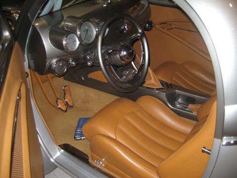1998 Ford Crown Victoria - The custom interior features tan leather seats and a unique dashboard with multiple gauges.
