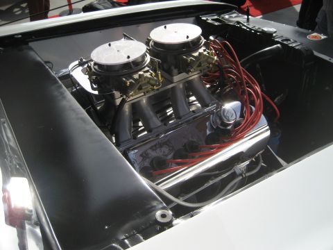1998 Ford Crown Victoria - Close-up view of a V8 engine dual carburetors and polished chrome components.