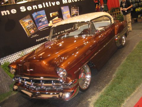 1998 Ford Crown Victoria - Customized 1955 coupe with a two-tone paint job and chrome accents is on display.
