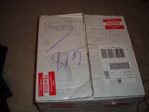 2006 Ford E350 - Two cardboard boxes are shown, one with a handwritten price of $19 and both marked with fragile shipping labels.