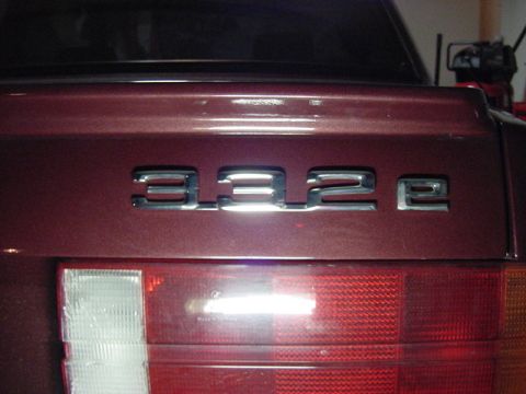 1984 BMW 3 Series - Close-up of a car's rear showing a 332e badge and taillight assembly.