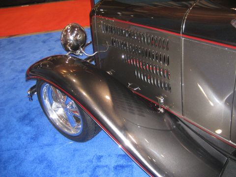 1998 Ford Crown Victoria - Detail shot of a custom hot rod's front fender and headlight assembly.