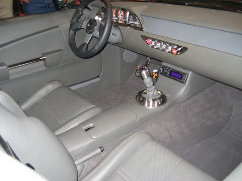 1998 Ford Crown Victoria - Interior view of a custom car, showing seats, dashboard, and shifter.
