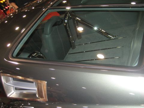 1998 Ford Crown Victoria - Custom car interior with roll cage and bucket seats visible through the rear window.