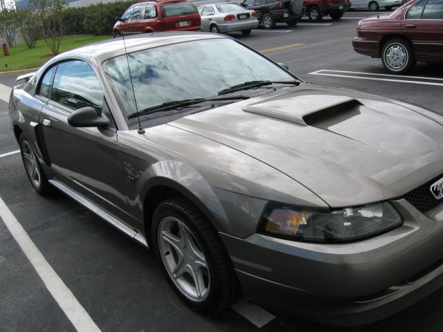 Gray New Edge Ford Mustang GT coupe front three-quarter view in a parking lot