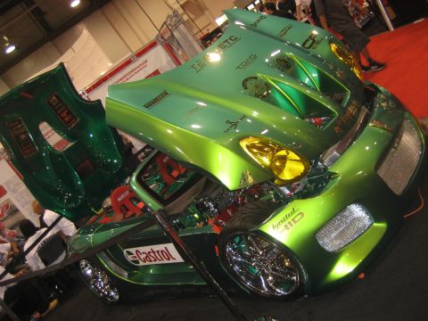 1998 Ford Crown Victoria - Custom green vehicle with its hood and doors open, displaying racing seats and engine components, a prominent Castrol logo.