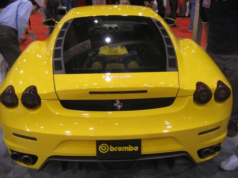 1998 Ford Crown Victoria - Rear view of a yellow Ferrari, its engine and Brembo brake system.