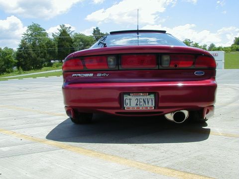 1994 Ford Probe - Red 1994 Ford Probe GT seen from the rear, showing the 'PROBE 24V' badging and GT emblem.