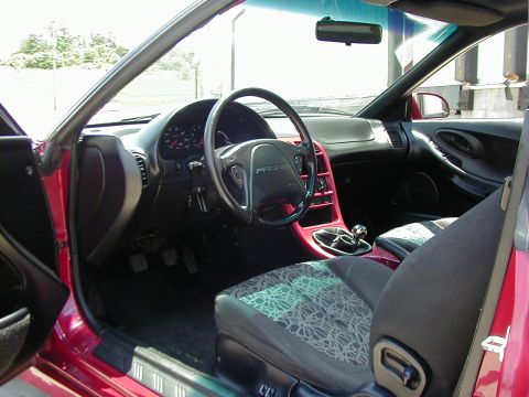 1994 Ford Probe - The interior of a 1994 Ford Probe features red trim accents and distinctive patterned seats.