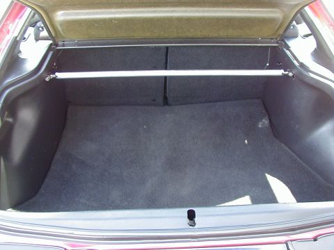 1994 Ford Probe - Car's trunk interior, a strut bar for chassis reinforcement.