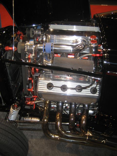 1998 Ford Crown Victoria - Custom V8 engine with chrome components and a prominent supercharger is displayed.