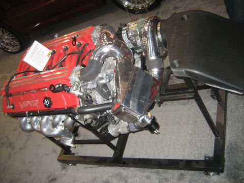 1998 Ford Crown Victoria - This is a Dodge Viper engine, not a 1998 Ford Crown Victoria, displayed on a stand.