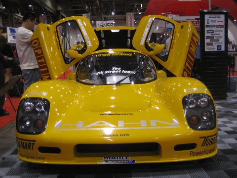 1998 Ford Crown Victoria - Yellow sports car with butterfly doors open, "HAHN" text on front, "ultima GTR" below it.
