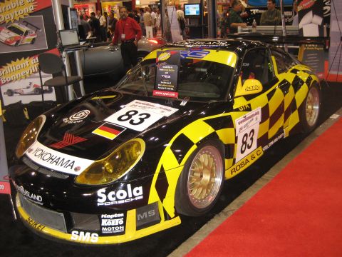 1998 Ford Crown Victoria - A race-prepped Porsche 911 GT3 with Yokohama tires and various sponsor decals is shown at an event.