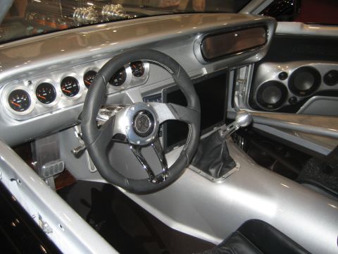 1998 Ford Crown Victoria - The custom interior features a silver dashboard, multiple aftermarket gauges, and a sporty steering wheel with a prominent logo.