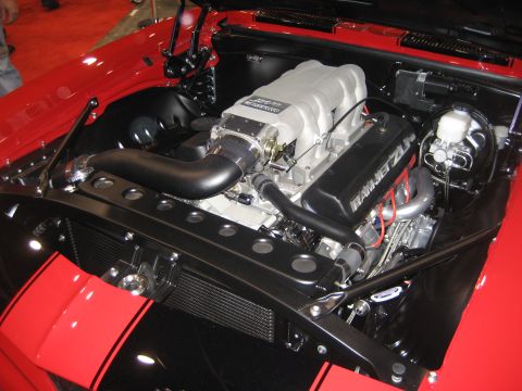 1998 Ford Crown Victoria - Close-up of a custom engine bay a prominent intake and detailed components.