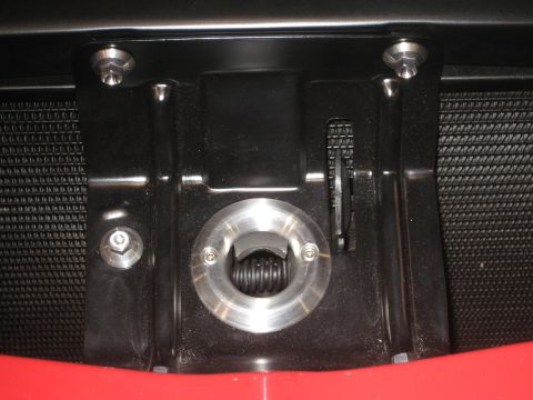1998 Ford Crown Victoria - Detail of a vehicle's front end, focusing on the tow hook mechanism and surrounding hardware.