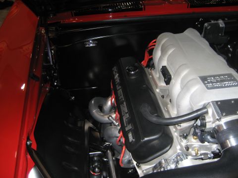 1998 Ford Crown Victoria - Engine bay detail a Ram Jet 502 engine with a polished intake manifold and red spark plug wires.