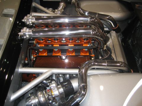 1998 Ford Crown Victoria - Close-up of a highly modified engine bay with polished chrome and custom components.