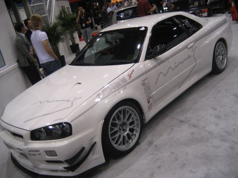 1998 Ford Crown Victoria - White Nissan Skyline GT-R R34 modified by Mine's Motor Sports.